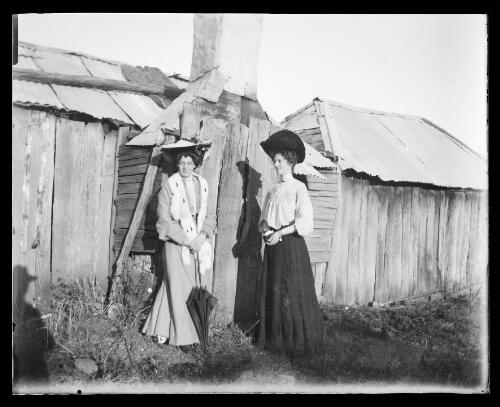 Two stylishly dressed women at Reno, a gold-mining centre near Gundagai, Reno is to the west of Gundagai, now a ghost town, New South Wales [picture] / Charles Gabriel