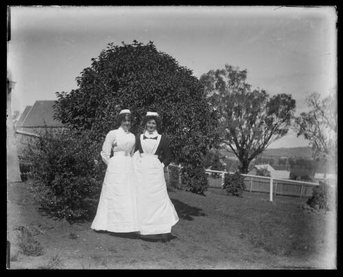 Two nurses at the back of the old hospital in Otway Street, Gundagai, New South Wales [picture] / Charles Gabriel