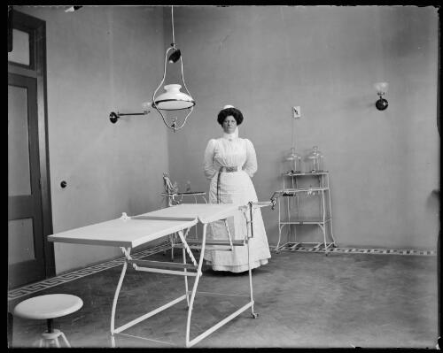 Matron Young in the new hospital operating theatre, Gundagai, New South Wales [picture] / Charles Gabriel
