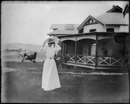 Nurse adjusting her hat outside new hospital, Gundagai, New South Wales, ca. 1904 [picture] / Charles Gabriel