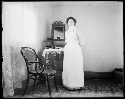 Nurse standing by dressing table, Gundagai, New South Wales [picture] / Charles Gabriel