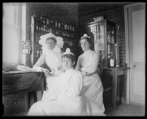 Three nurses in the dispensary of old hospital, Gundagai, New South Wales [picture] / Charles Gabriel