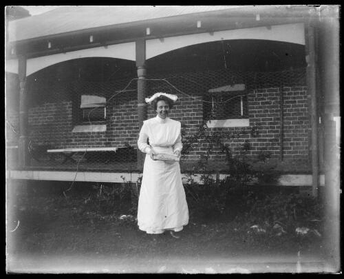 Nurse holding a copy of The Bulletin, Gundagai, New South Wales [picture] / Charles Gabriel