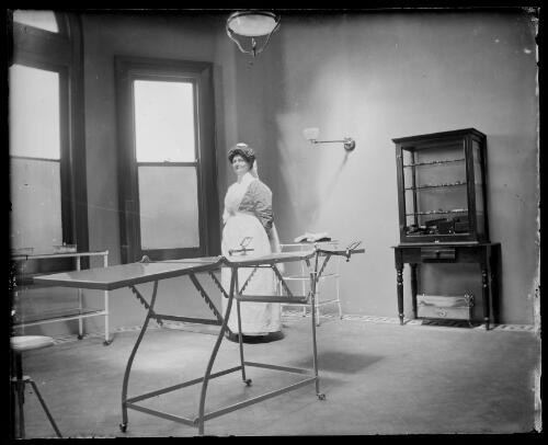 Matron Young in the operating theatre in the new hospital, Gundagai, New South Wales [picture] / Charles Gabriel