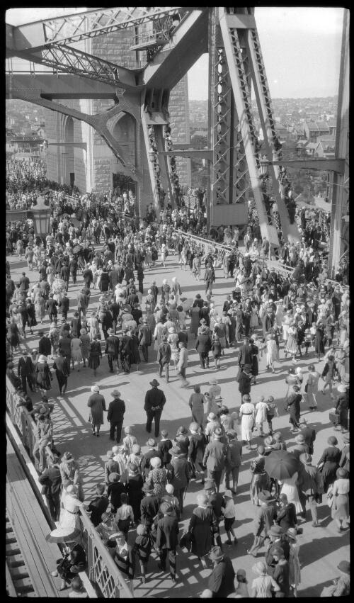 Crowds on the Sydney Harbour Bridge after opening ceremony, looking towards north-east pylon and Neutral Bay [picture] / Harold Cazneaux