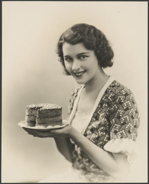 Portrait of Patricia Minchin holding a cake, Chatswood, New South Wales, 1932 [picture] / Harold Cazneaux