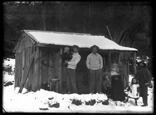 The William Braithwaite family in the snow outside their house at their mine, Mt. Dromedary, New South Wales, ca. 1895 [picture] / [William Henry Corkhill]