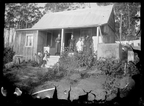 [Five people standing on the verandah of a house] [picture] / [William Henry Corkhill]