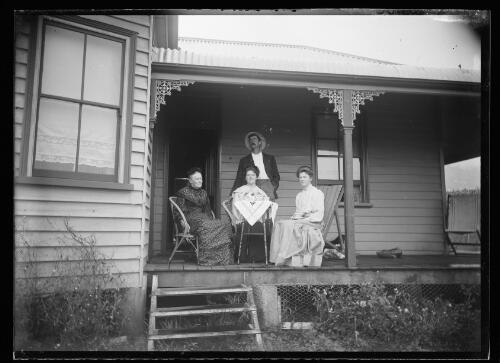 [Mrs Percival, daughter Lily, Henry John Bate and Miss Percival on the verandah of a house] [picture] / [William Henry Corkhill]