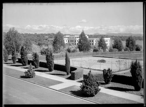 [House of Representatives garden tennis courts with Parliament House in background, Canberra] [picture] / R.C. Strangman