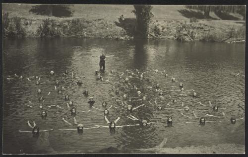 Children participating in swimming lessons in a river, Tumut [?], New South Wales [picture] / R.C. Strangman