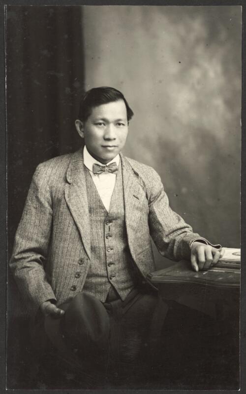 [Portrait of unidentified young Southeast Asian man seated wearing a striped suit, Tumut, New South Wales] [picture] / R.C. Strangman