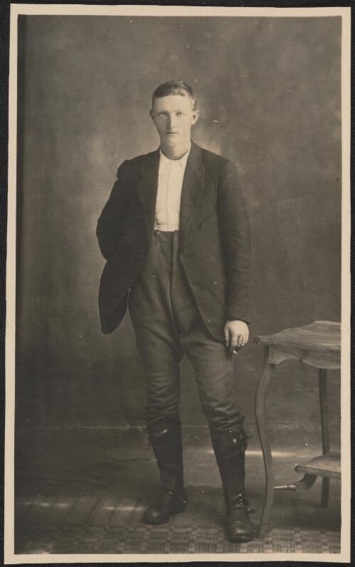 Portrait of a young man in gaitors with hand behind his back, Tumut, New South Wales  / R.C. Strangman