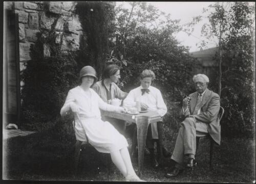 Cappy Deans, Marion Mahony Griffin, Walter Burley Griffin, and George Walter Griffin in the Griffin's garden at Castlecrag, New South Wales, ca. 1930 [picture]