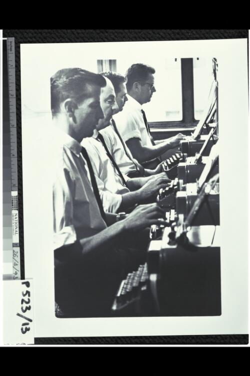 Teleprinter operators at the office of OTC in Lonsdale Street, Melbourne, 1965 [picture] / Mark Strizic