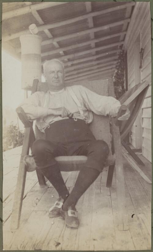 Portrait of Bishop Stretch of Newcastle sitting on a porch, Dubbo Region, New South Wales, ca. 1915 [picture] / E.C. Kempe