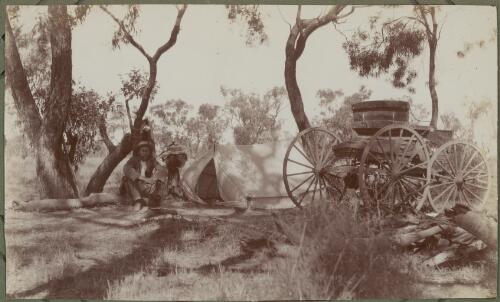 An opal miner sitting beside a camp site at Lightning Ridge, New South Wales, 1911 [picture] / E.C. Kempe