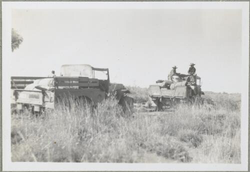 Two light trucks in the desert grassland? Northern Territory, 1947 [picture] / Arthur Groom