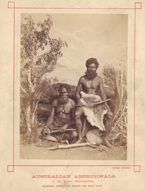 Studio portrait of two Aboriginal Australian men with boomerangs and a shield, ca. 1873 [picture] / J.W. Lindt