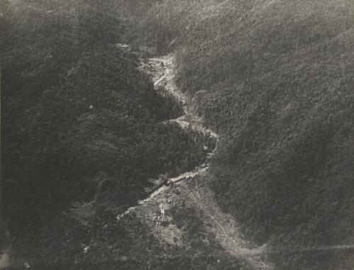 Aerial view of Bulolo Gold Dregding coy's hydro-electric scheme and one of first roads cleared in the New Guinea goldfields [picture]