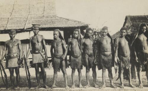 Six fellows of the Kuku Kuku (mainland) tribes, who have struck trouble with the police who form their escort [picture]