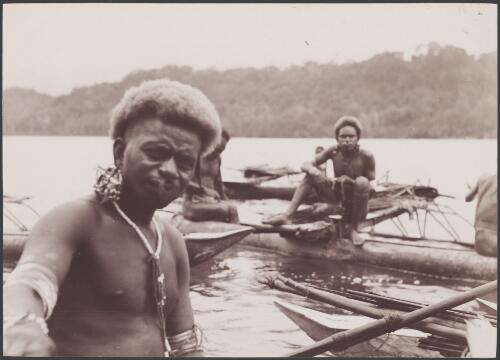 Santa Cruz men in canoes, Graciosa Bay, Solomon Islands, 1906 / J.W. Beattie