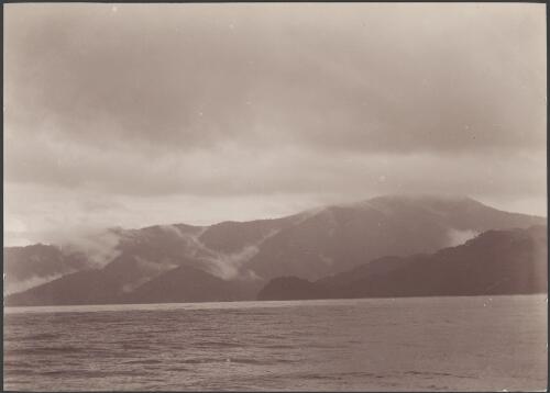 Wet weather on the coast of Wanderers Bay, Guadalcanar Island, Solomon Islands, 1906, 1 / J.W. Beattie