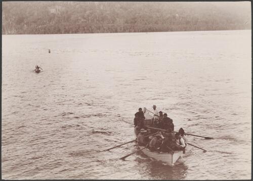 Reverend Arthur Hopkins and villagers in his whale boat, Solomon Islands, 1906 / J.W. Beattie
