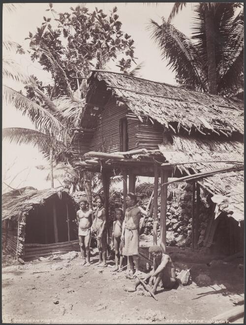 Men standing under a stilt house in the village of Foate, Malaita, Solomon Islands, 1906 / J.W. Beattie