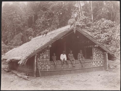 Three men and a boy sitting in a gamal at Ahia, Solomon Islands, 1906 / J.W. Beattie
