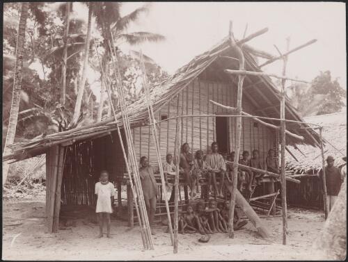 Men and children sitting at the entrance of a Kombe house, Solomon Islands, 1906 / J.W. Beattie