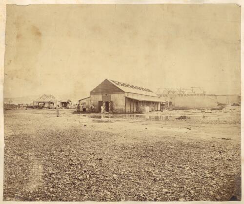 Foreshore of dock area showing damage to buildings after cyclone of 1878, Noumea, New Caledonia [picture] / Allan Hughan