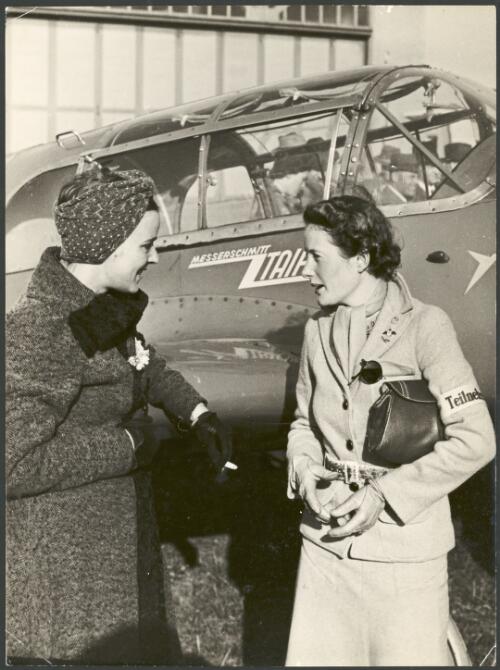 Elly Beinhorn (left) and Nancy Walton standing next to Elly's Messerschmitt Me-108 monoplane 'Taifun', Germany, 1938 [picture]