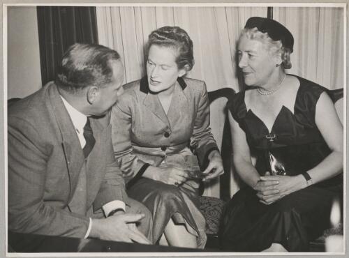Nancy Walton (centre) talks to John L. Waddy and Maie Casey at a cocktail party at Nancy's house, Sydney, 22 June 1954 [picture]
