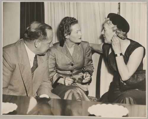 Nancy Walton (centre) talks to Maie Casey and John L. Waddy at a cocktail party at her home, Sydney, 22 June 1954 [picture]