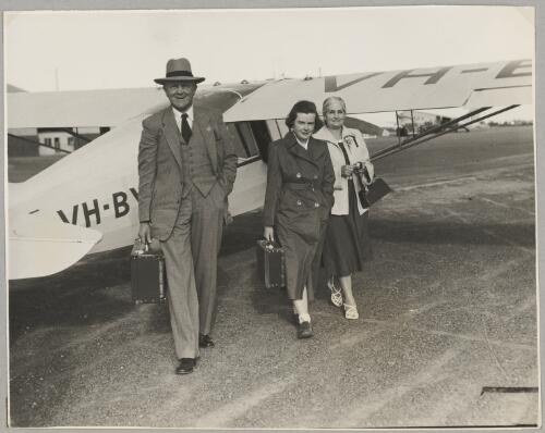 Grace Cavanagh with her father Albert and mother next to Auster J/5G Cirrus Autocar monoplane VH-BYD after arriving at Bankstown Aerodrome during the second Australian Women Pilots' Association Reliability Trials, Sydney, September 1954 [picture]