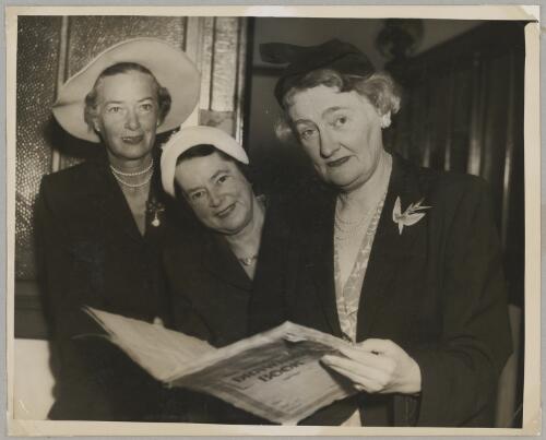 Maud Gardner, Evelyn Follett and Meg Skelton examining a book, ca. 1955 [picture]