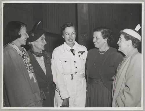 Australian Women Pilots' Association member Nancy Leebold (centre) with Alix Newbigin, Nancy's mother, Marie Richardson and Nancy's mother-in-law (from left) after Nancy's flight from England to Australia, Bankstown Airport, Sydney, 20 June 1955 [picture]