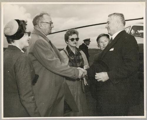 Nancy Walton, an unidentified man, Freda Thompson and Maie Casey meet Minister for Army and Navy Josiah Francis at Moorabbin Airport, Melbourne, 8 October 1955 [picture]