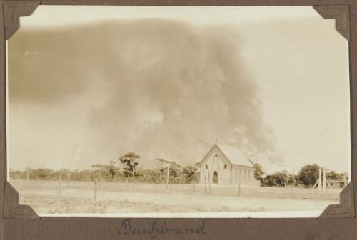 Church with smoke from a bushfire in the background, Koonibba Mission, South Australia, ca. 1925 [picture]