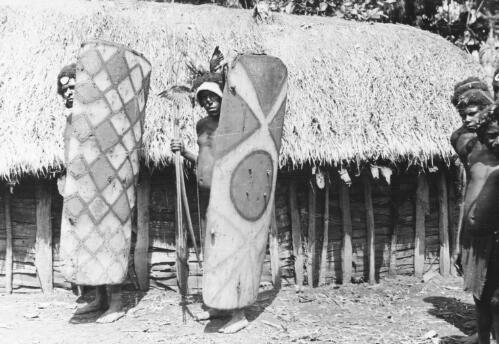 Highlands men with shields, Papua New Guinea, ca. 1930s [picture] / Michael Leahy
