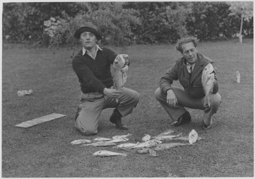 Edouard Borovansky and Serge Bousloff displaying fishing catch [picture]