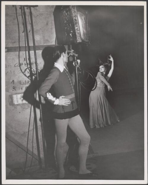 Nicholas Ivangine waits in the wings for his entrance while Dorothy Stevenson dances in the Fantasy on Grieg's Concerto in A Minor, Borovansky Ballet, at the Theatre Royal, Sydney, 1944 [picture] / Jo Fallon