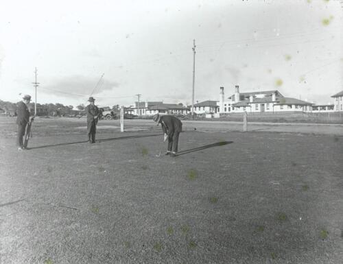 Golfers behind Hotel Canberra [picture] / W.J. Mildenhall
