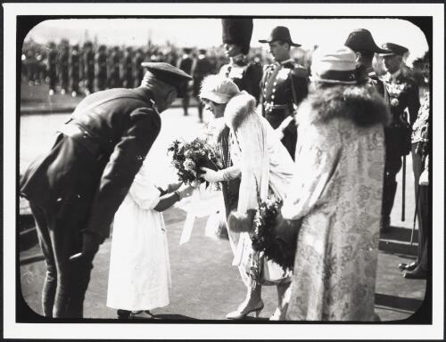 Duchess of York receiving flowers from Gwen Pinner at the opening of Parliament House, Canberra, 1927 [picture] / W.J. Mildenhall