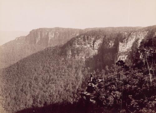 [Man standing on a cliff and looking at the Blue Mountains] [picture] / C. Bayliss
