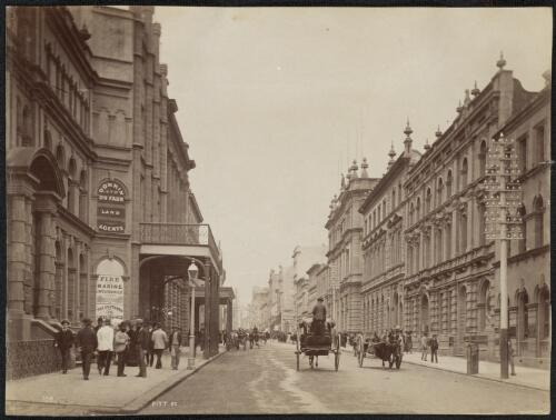 Pitt Street with signs advertising land agents and insurance, Sydney, New South Wales, ca. 1880 [picture] / Charles Bayliss