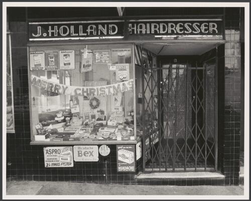Cigarette advertisements on window of J.Holland hairdresser shopfront, Oxford Street, Sydney, ca. 1974 [picture] / Greg Battye