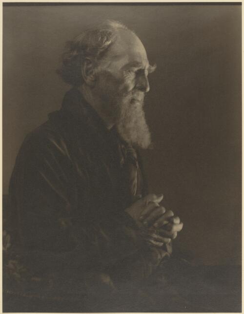 Portrait of an elderly man in a smoking jacket holding his hands together, Victoria / Jno Eaton