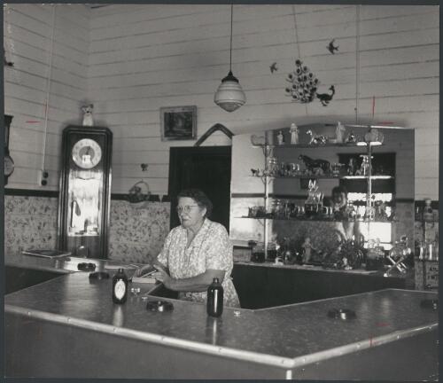 Annie Lack behind the bar at Tattersall's Hotel, Barringun, New South Wales, ca. 1972 [picture] / Bruce Howard